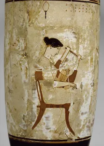 Attic white-ground lekythos decorated with a woman playing a cithara (glazed terracotta) Attic white-ground lekythos decorated with a woman playing a cithara (glazed terracotta)