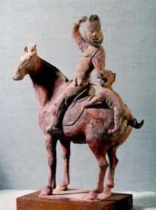Barbarian horseman Hou mastering a felin. Terracotta statuette made during the Tang Barbarian horseman Hou mastering a felin. Terracotta statuette made during the Tang