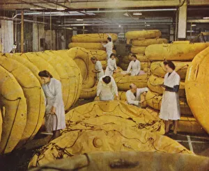 British women factory workers manufacturing self-inflating rubber dinghies, World War II, 1939-1945 (photo) British women factory workers manufacturing self-inflating rubber dinghies, World War II, 1939-1945 (photo)