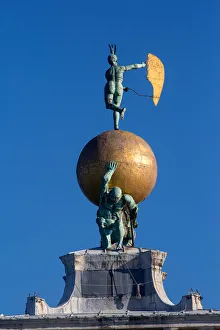 Bronze statue of Fortune at the top of the Punta della Dogana, Venice (photo) Bronze statue of Fortune at the top of the Punta della Dogana, Venice (photo)