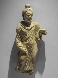 Buddha carrying the almones bowl. Afghanistan, Hadda site, 3rd and 4th. Stucco Buddha carrying the almones bowl. Afghanistan, Hadda site, 3rd and 4th. Stucco