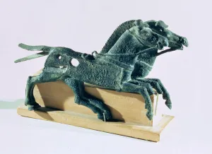 Cheek pieces in the form of horses, found in ashes in the portico of the Hundred Column Cheek pieces in the form of horses, found in ashes in the portico of the Hundred Column