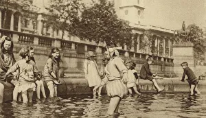 Children enjoying a paddle in Trafalgar Square during a heatwave (b/w photo) Children enjoying a paddle in Trafalgar Square during a heatwave (b/w photo)