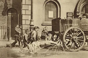 Children in Poplar enjoying the passing of a water cart during a heatwave (b/w photo) Children in Poplar enjoying the passing of a water cart during a heatwave (b/w photo)