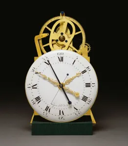 A close up view of the dial and movement of a Louis XVI ormolu A close up view of the dial and movement of a Louis XVI ormolu