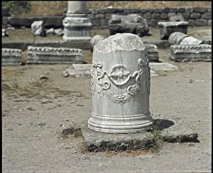 Column decorated with the symbol of the god Asclepios. Sanctuary of Asclepios Column decorated with the symbol of the god Asclepios. Sanctuary of Asclepios
