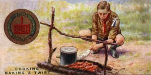 Cook Proficiency Badge for Scouts - Baking a Twist , 1929 (colour litho) Cook Proficiency Badge for Scouts - Baking a Twist , 1929 (colour litho)