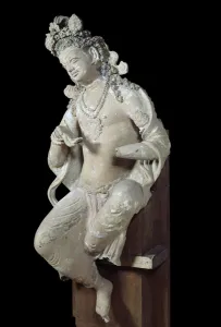 Devata (female divinite) sitting. Sculpture in dry stone. 7th century Devata (female divinite) sitting. Sculpture in dry stone. 7th century