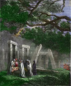 Druids practicing a human sacrifice at Stonehenge stopped by Roman soldiers - Human sacrifice by the druids a Druids practicing a human sacrifice at Stonehenge stopped by Roman soldiers - Human sacrifice by the druids a