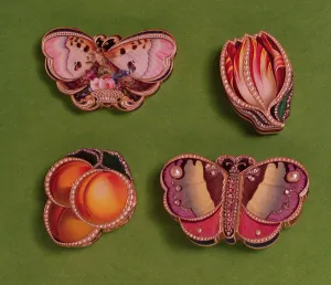 Four enamelled and jewelled boxes, butterfly, tulip and peach-shaped Four enamelled and jewelled boxes, butterfly, tulip and peach-shaped