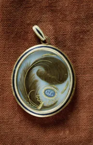 Enamelled locket containing a lock of hair with the initials C. L Enamelled locket containing a lock of hair with the initials C. L