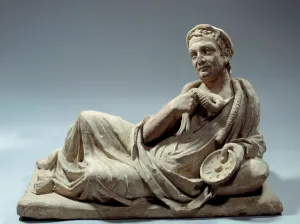 Etruscan art: burial urn cover in terracotta representing an age holding phiale a Etruscan art: burial urn cover in terracotta representing an age holding phiale a