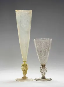 A Facon-de-Venise Latticinio wine glass and a flute, both late 16th century A Facon-de-Venise Latticinio wine glass and a flute, both late 16th century