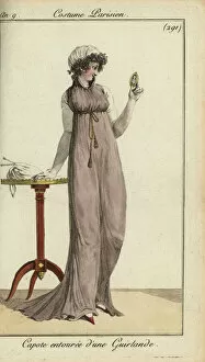 Fashionable woman looking at a locket, 1801 (handcoloured copperplate engraving)