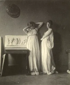 Two Female Models in Classical Costume with Eakinss Sculpture Arcadia, c Two Female Models in Classical Costume with Eakinss Sculpture Arcadia, c