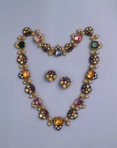 A fine Regency gold and jewelled necklace set with cushion-cut topaz, amethysts A fine Regency gold and jewelled necklace set with cushion-cut topaz, amethysts