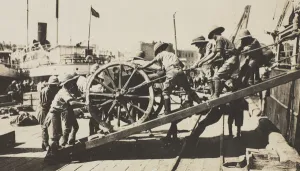 Gangplank Gallery: One of the first British Army guns to arrive in Baku is manhandled down a gangplank into