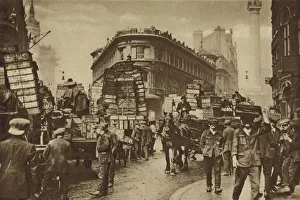 Fish-porters of Billingsgate gathered about consignments lately arrived from the coast Fish-porters of Billingsgate gathered about consignments lately arrived from the coast