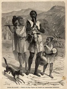 A flute player, accompanied by a small drummer and a monkey show A flute player, accompanied by a small drummer and a monkey show