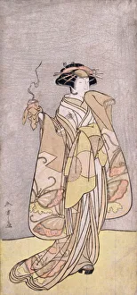 1766510 A full-length portrait of the actor Ichikawa Monnosuke II in a female role holding an incense burner (colour woodblock print) by Shunsho, Katsukawa (1726-93); 32.4x15 cm; Private Collection; (add.info.: A full-length portrait of the actor Ichikawa Monnosuke II in a female role holding an incense burner. Katsukawa Shuncho (1726-1792). Hosoban. 32.4 x 15cm.); Photo © Christie's Images; Japanese, out of copyright A full-length portrait of the actor Ichikawa Monnosuke II in a female role holding an incense burner (colour woodblock print)