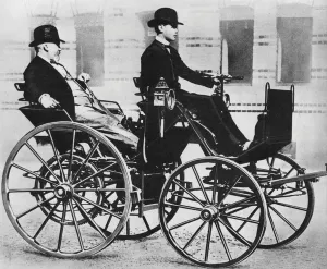Gottlieb Daimler, with his son driving, in the first motor car, 1886 (b/w photo) Gottlieb Daimler, with his son driving, in the first motor car, 1886 (b/w photo)