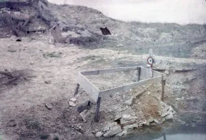 Grave of an unknown French soldier with his gun, next to a shell crater on the Western Grave of an unknown French soldier with his gun, next to a shell crater on the Western