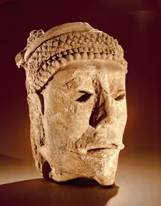 Head cut from a wall at Comalcalco, Tabasco, Classic Maya (stucco) Head cut from a wall at Comalcalco, Tabasco, Classic Maya (stucco)