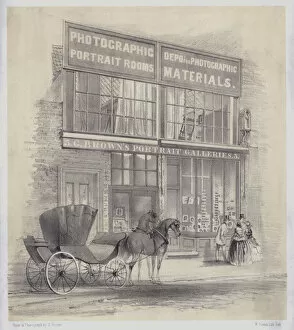Horse-drawn carriage waiting in the street outside a photographic studio (litho)