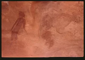 Tassili n'Ajjer Collection: Human figure and a bull (rock painting)