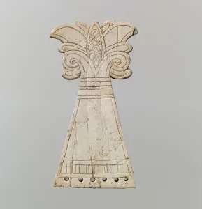 Incised horse frontlet carved into the shape of a flowering, volute palmette tree Incised horse frontlet carved into the shape of a flowering, volute palmette tree