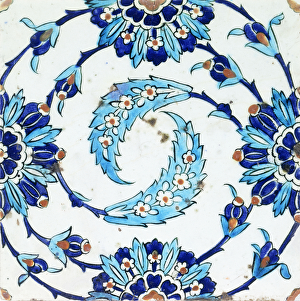 An Iznik pottery tile, with a spiralling floral motif, early 17th century (ceramic) An Iznik pottery tile, with a spiralling floral motif, early 17th century (ceramic)
