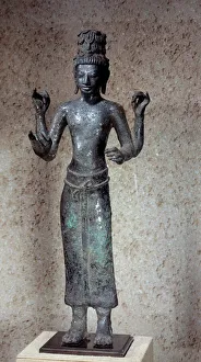 Khmer art: statue of Maitraya standing. Bronze sculpture. 8th century. From Cambodia Khmer art: statue of Maitraya standing. Bronze sculpture. 8th century. From Cambodia