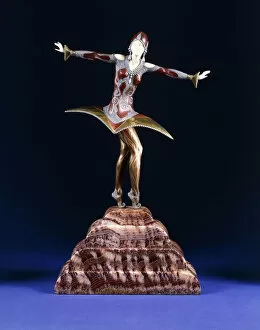 Dimitri Chiparus Gallery: Kora, a figure of an exotic dancer, (gilt, cold-painted bronze and ivory on red marble plinth)