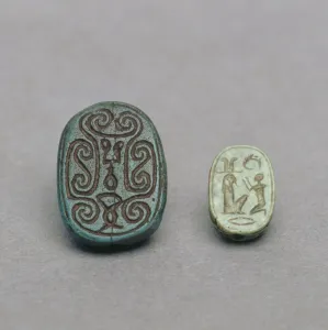 (L-R) Egyptian faience scarab amulet, Second Intermediate Period, 13th-17th Dynasty, c (L-R) Egyptian faience scarab amulet, Second Intermediate Period, 13th-17th Dynasty, c