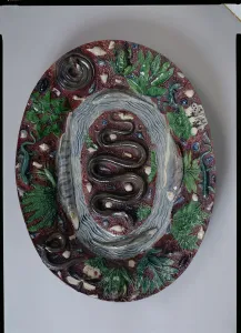 Large oval dish moulded in relief with a grass snake, batrachians and fish (earthenware) Large oval dish moulded in relief with a grass snake, batrachians and fish (earthenware)