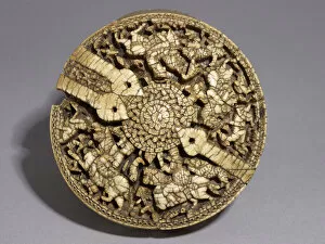 Huntsman Collection: Lid of a container decorated with four huntsmen and animals, Umayyad period