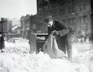 Occupations Gallery: Mailman Collecting Mail from Mailbox after Blizzard, Washington DC, 1922 (b/w photo)