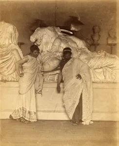Two male students in Grecian Costume before a plaster cast of the three fates Two male students in Grecian Costume before a plaster cast of the three fates