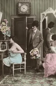 Man bringing a bouquet to a dressing woman (colour photo) Man bringing a bouquet to a dressing woman (colour photo)