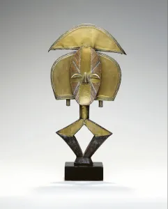 Mbulu Ngulu, A Kota Reliquary Figure (brass, copper & iron) Mbulu Ngulu, A Kota Reliquary Figure (brass, copper & iron)
