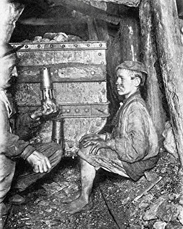 Miner and Child with lamp in a coal mine, 1906 (b / w photo))
