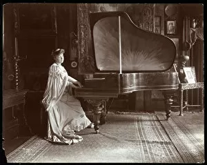 Daydreaming Gallery: Mrs. I. M. Clark seated at a grand piano, 1904 (silver gelatin print)