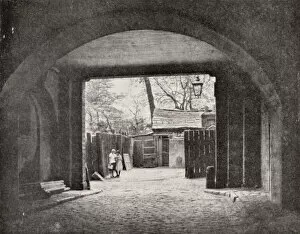 Old cottage seen through one of the Adelphi Arches, Strand, London (b / w photo)