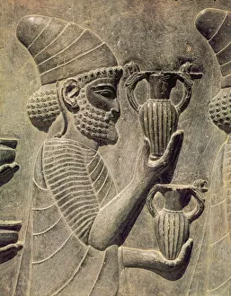 Phoenician carrying two vases as an offering, detail of the relief frieze on the east Phoenician carrying two vases as an offering, detail of the relief frieze on the east