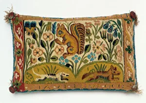 A pin cushion tapestry panel with a squirrel and motto,'good will is all, 1688 A pin cushion tapestry panel with a squirrel and motto,'good will is all, 1688