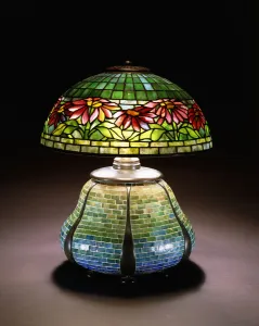 A Poinsettia leaded glass table lamp, c. 1902-1932 (leaded glass, mosaic A Poinsettia leaded glass table lamp, c. 1902-1932 (leaded glass, mosaic