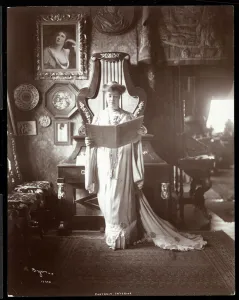 Portrait of Mrs. I. M. Clark standing with an open book, 1904 (silver gelatin print) Portrait of Mrs. I. M. Clark standing with an open book, 1904 (silver gelatin print)