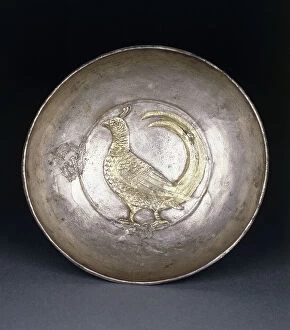 Crockery Gallery: A post-Sasanian silver dish containing a repousse gold pheasant, c. 8th century AD (silver, gold)