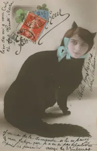 Postcard of a cat with a woman's face, sent in 1913 (photo) Postcard of a cat with a woman's face, sent in 1913 (photo)