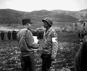 Private Jonathan Hoag is awarded the Croix de Guerre by French General Alphonse Juin, Italy, 21st March, 1944 Private Jonathan Hoag is awarded the Croix de Guerre by French General Alphonse Juin, Italy, 21st March, 1944